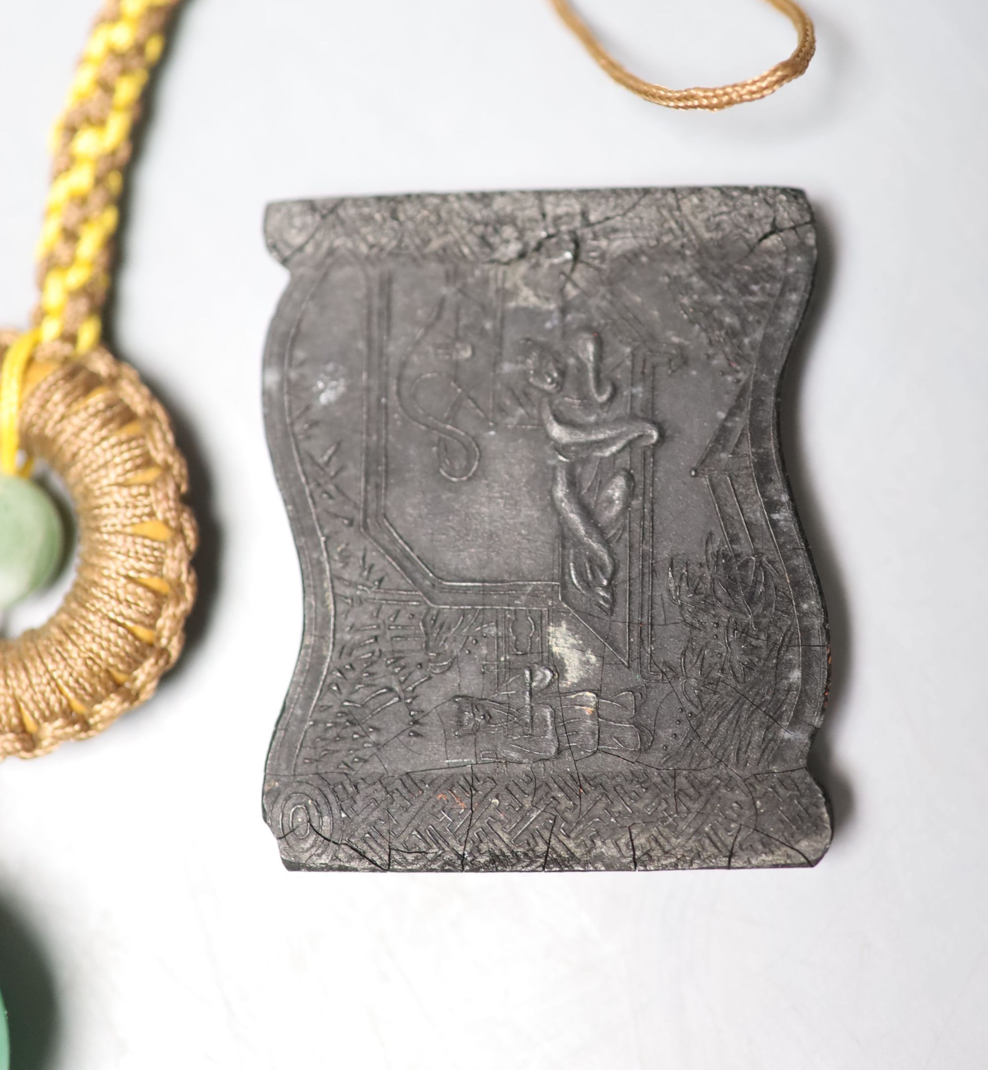 Assorted Chinese small items including two Chinese inkstones, a similar hardstone seal and pendant